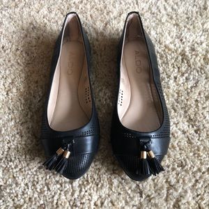 Black Aldo flats with tassel detail